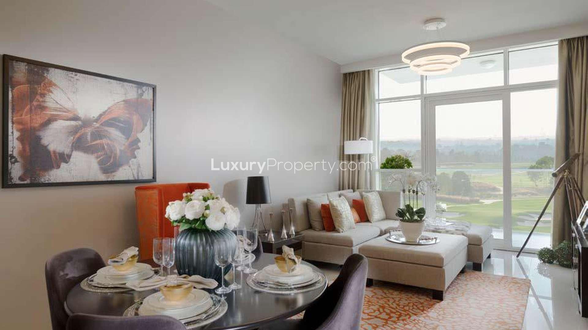 Couple enjoying balcony view from luxury suite in Radisson Dubai, Damac Hills