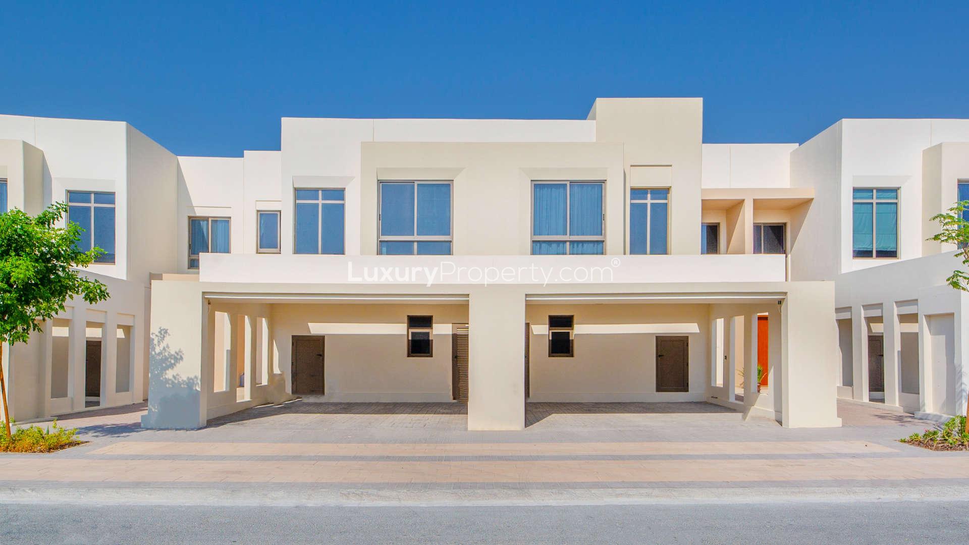 Empty room with large window in Hayat Townhouses, Dubai Town Square for sale