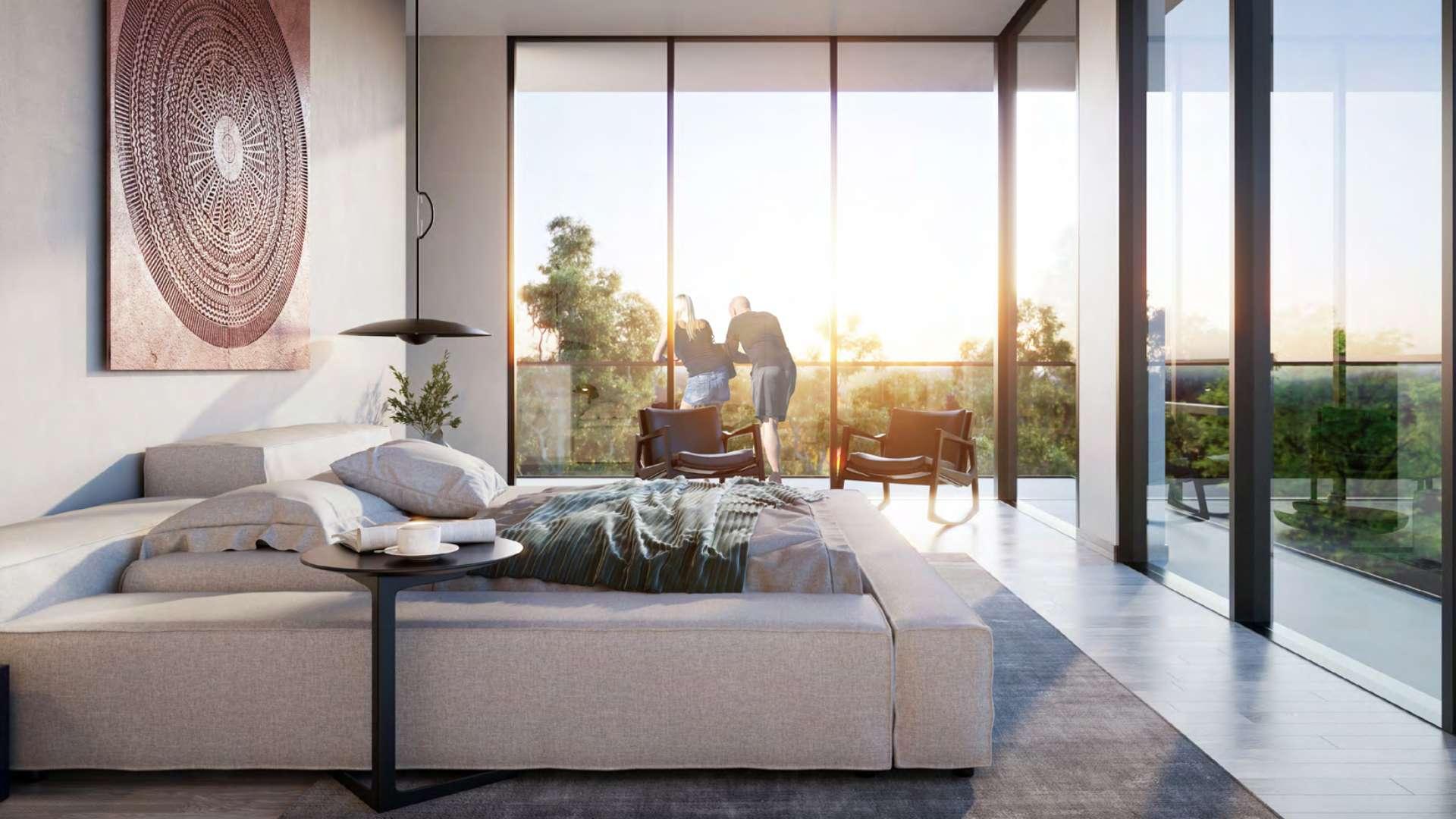 Modern living area in Jouri Hills townhouse, Jumeirah Golf Estates, with garden view