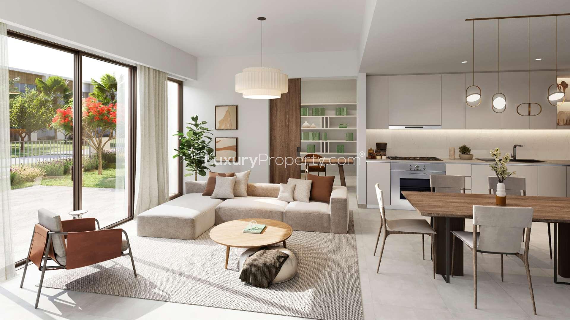 Modern townhouse community in Orania, The Valley, with lush landscaping and pedestrian pathway