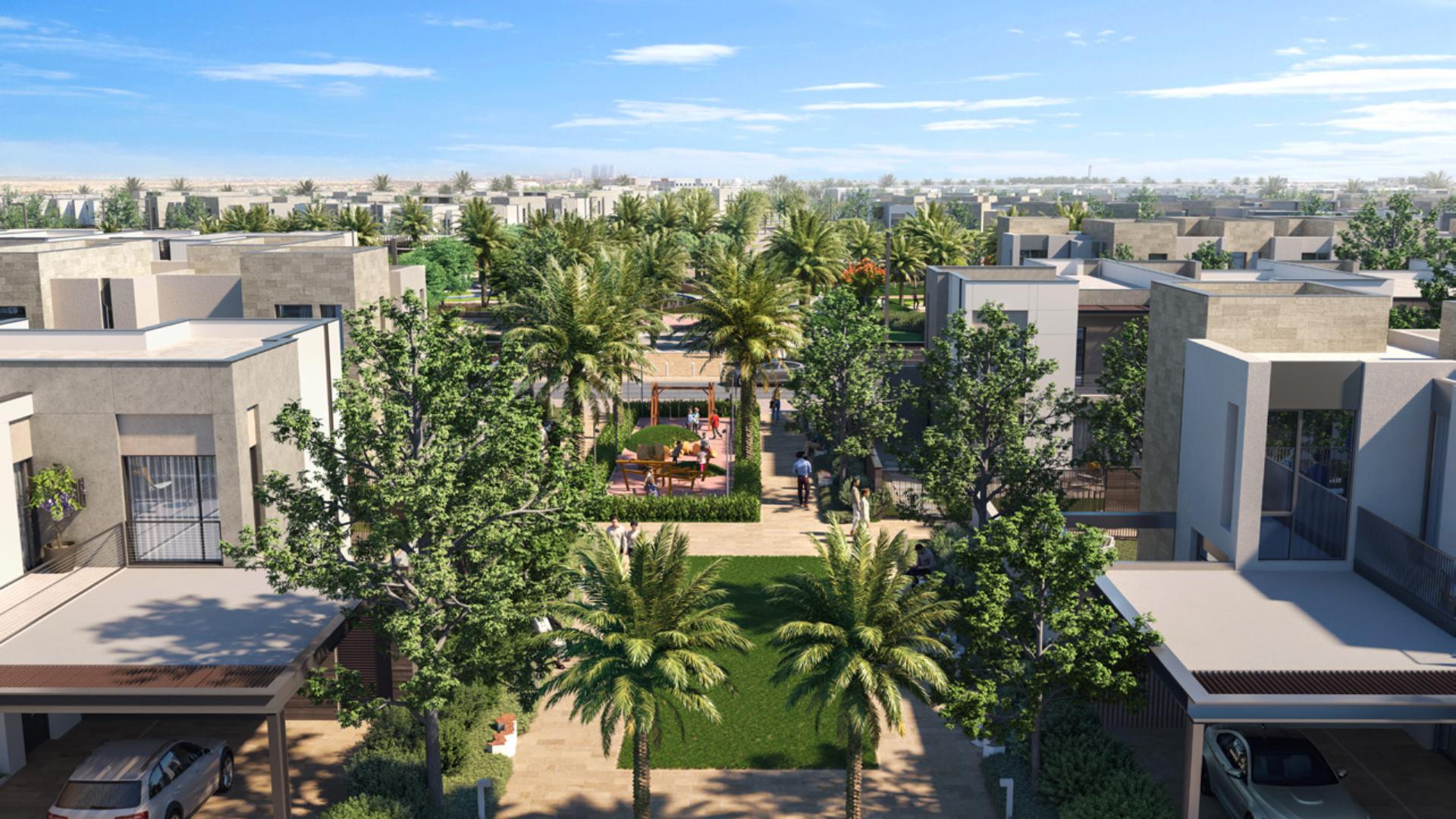 Modern townhouse exterior in Raya, Arabian Ranches III, surrounded by lush greenery and pathways