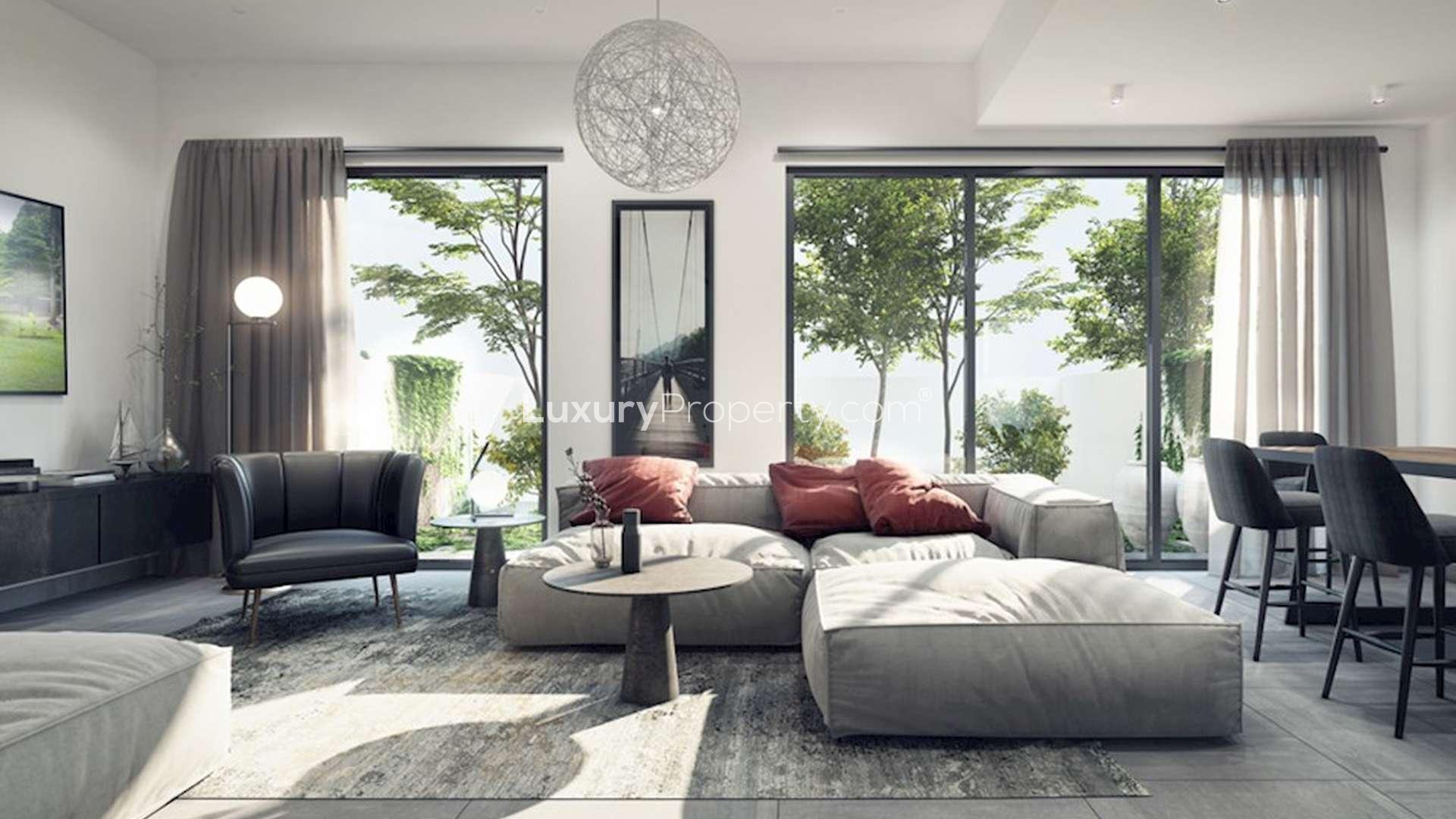 Modern Sarab luxury townhouses in Aljada, Sharjah, featuring sleek architecture and vibrant community life