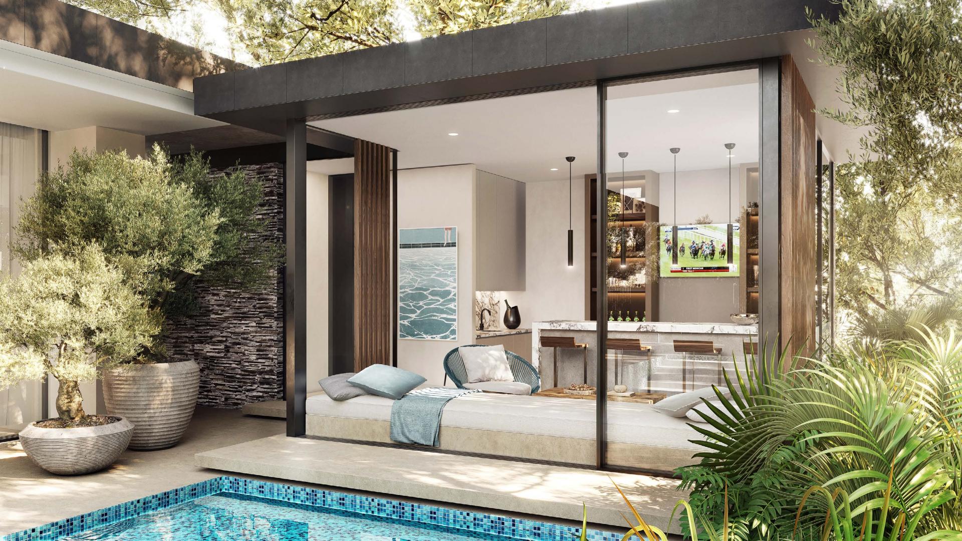 Luxurious Alaya Villa with poolside view in Tilal Al Ghaf, surrounded by lush greenery