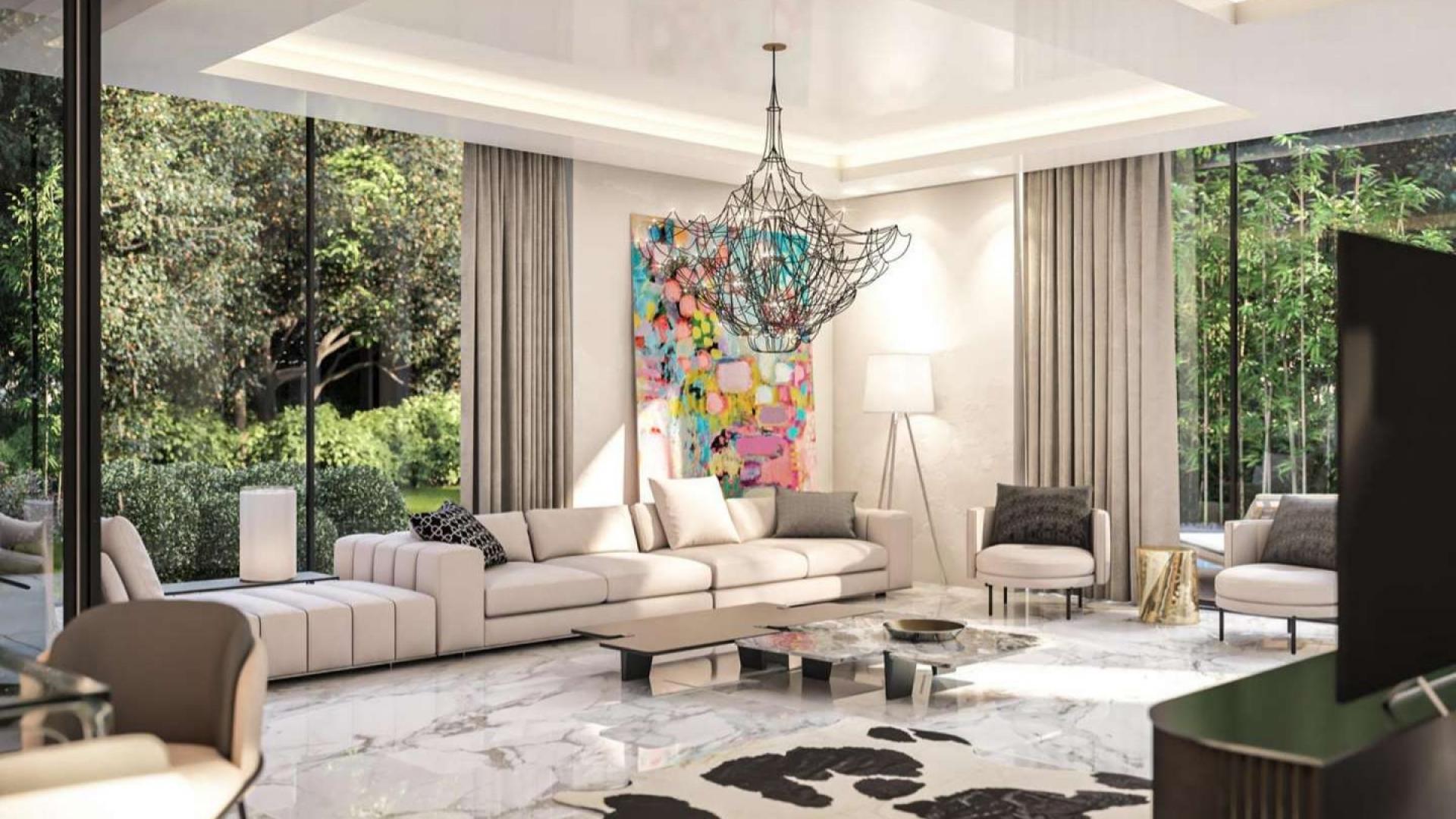 Luxurious living room in Chorisia Villas, Al Barari, featuring modern decor and garden views
