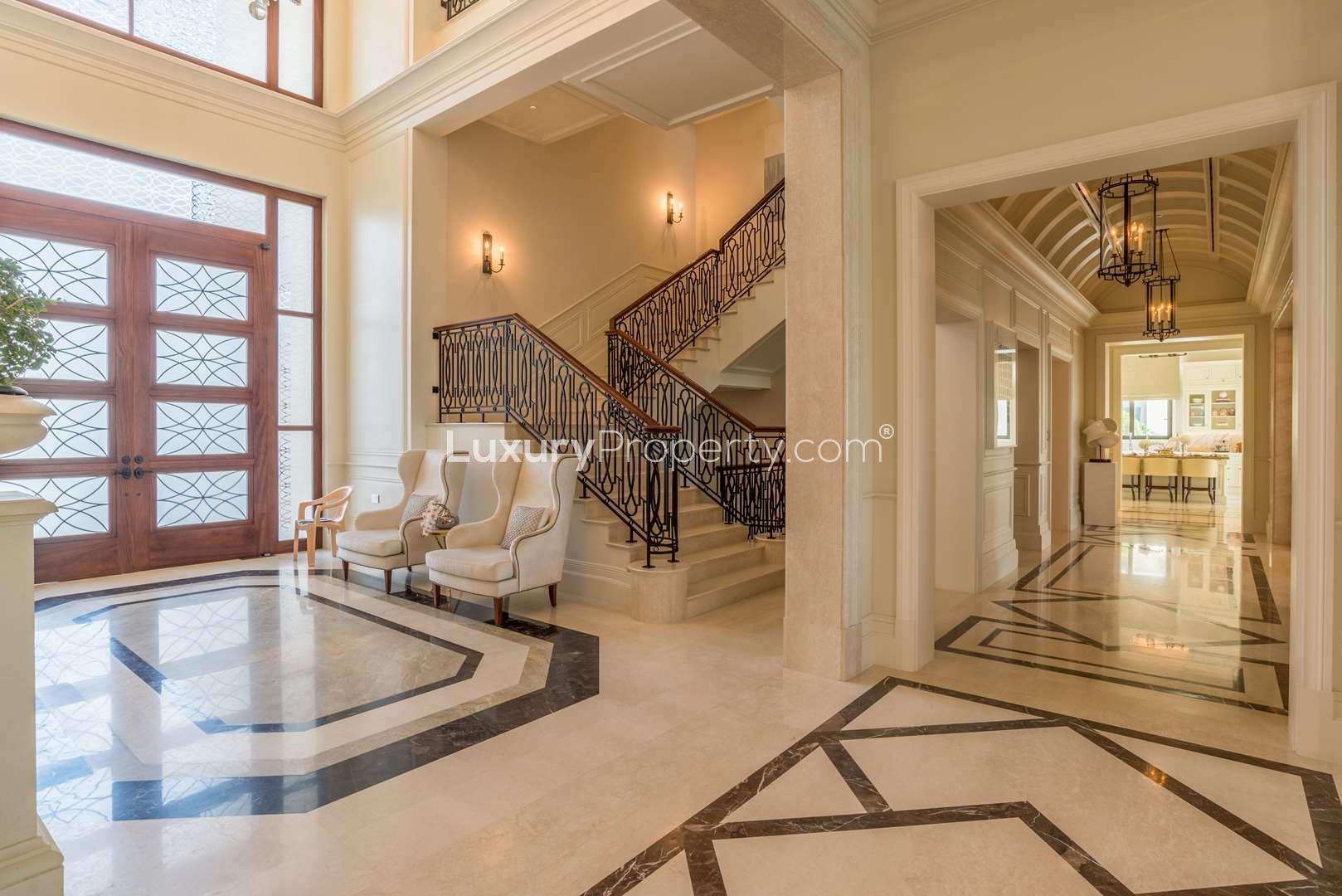 Elegant dining room in Dubai Hills Mansions villa with luxurious decor and large windows