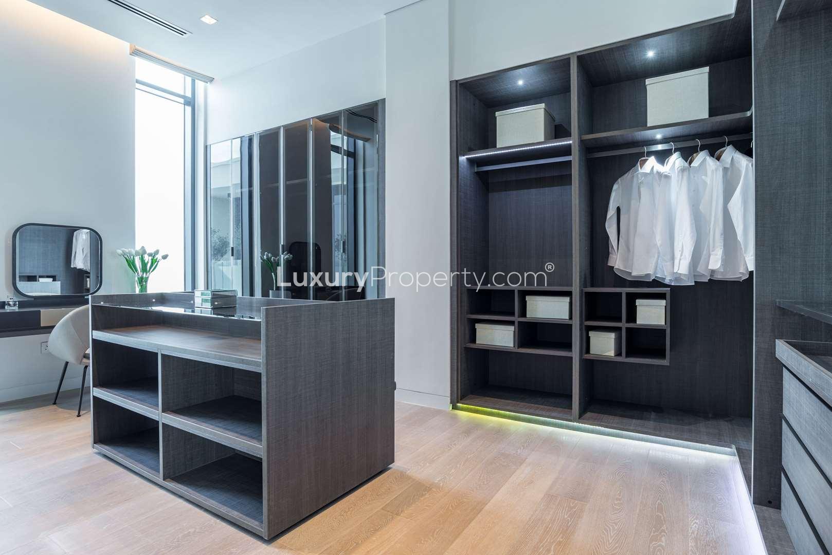 Modern villa entrance hallway in Hillside, Jumeirah Golf Estates, with elegant decor and lighting