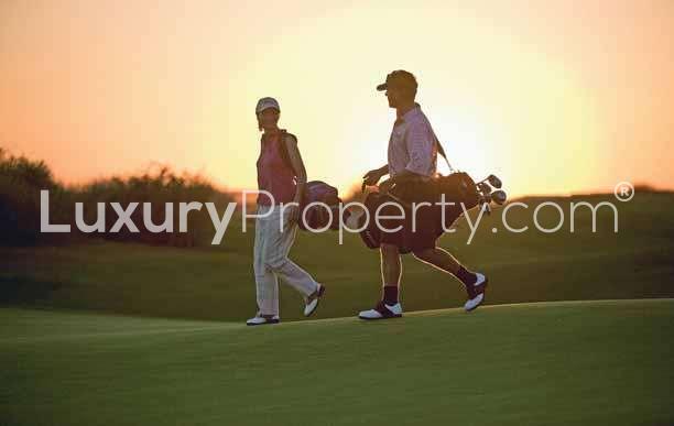 Luxury villa patio with pool and seating at La Avenida, Arabian Ranches for sale