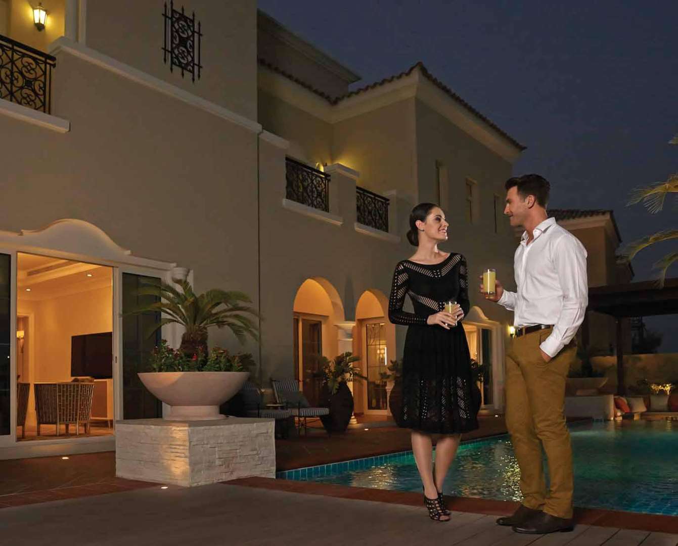 Golfers enjoying sunset at Arabian Ranches, highlighting luxury villa lifestyle at La Avenida