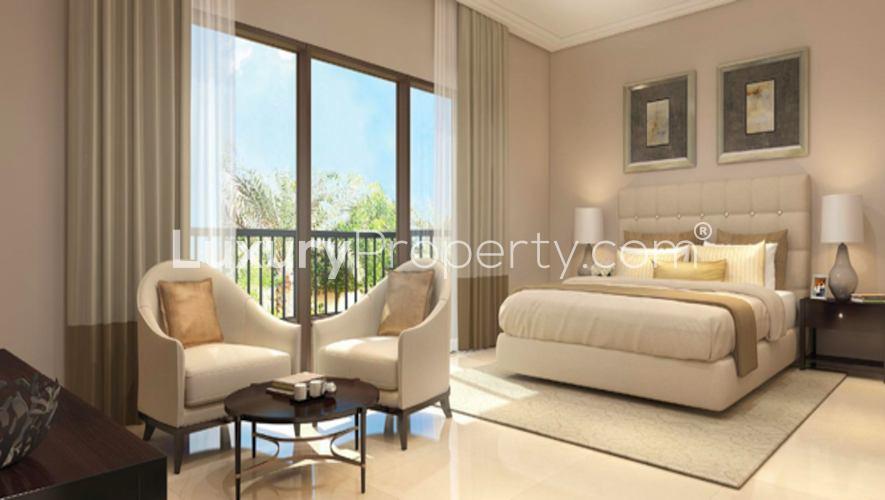 "Samara Residences villa exterior in Arabian Ranches 2, Dubai, with carport and palm trees.",Studio villa interior at Samara Residences, Arabian Ranches 2, Dubai, for sale