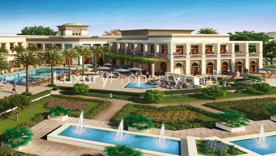 Exterior view of Samara Residences villa, Arabian Ranches 2, lush gardens and pool area.